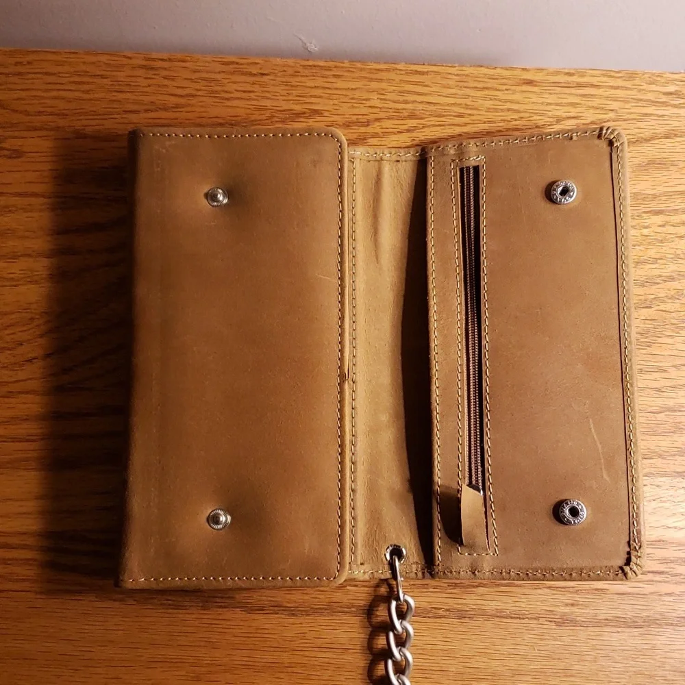 Unbranded tri-fold brown leather wallet with 19